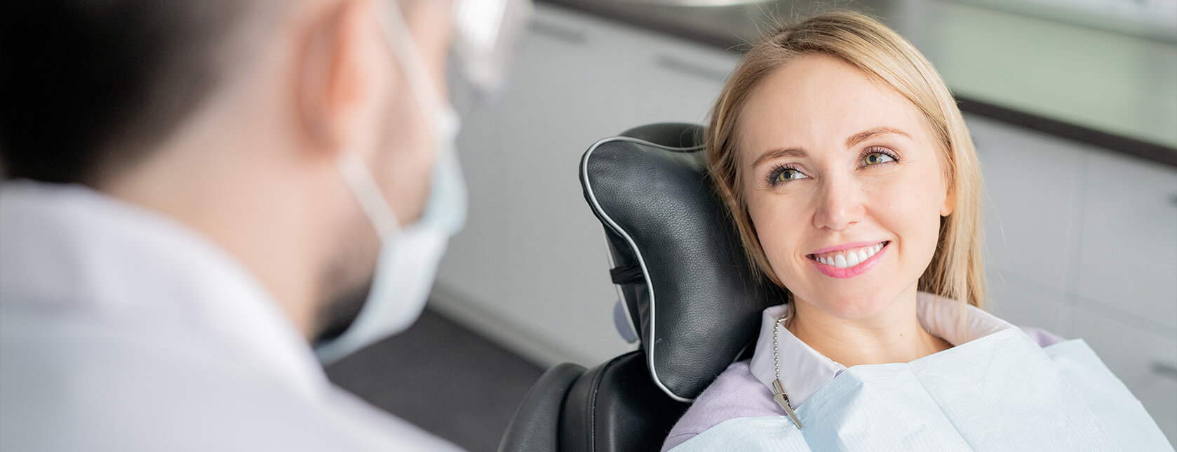 smiling woman sitting in a dental chair