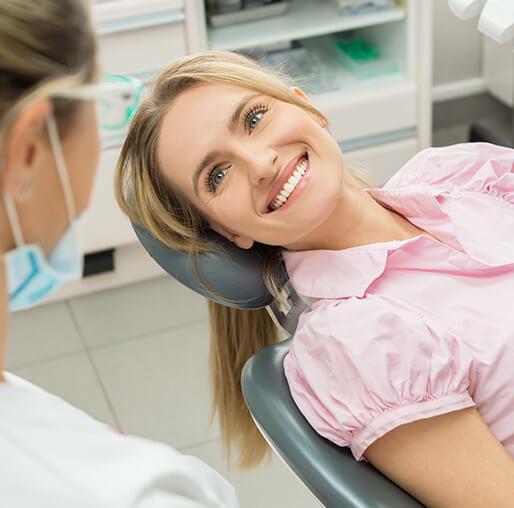 smiling woman sitting in a dental chair