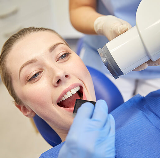 woman receiving dental x-rays