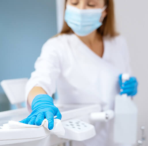 staff member cleaning a surface