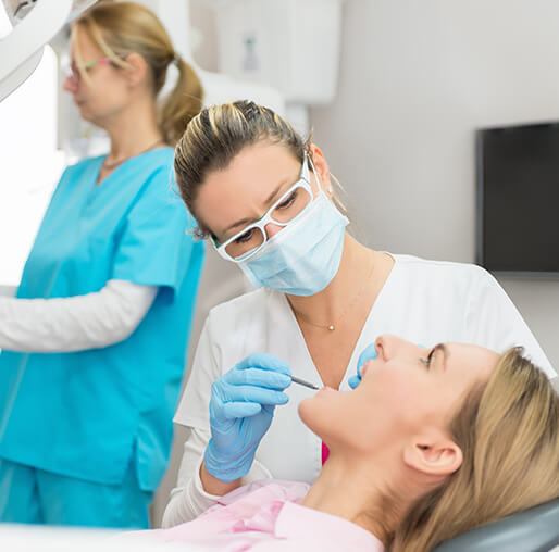 dentist examining a patient's mouth