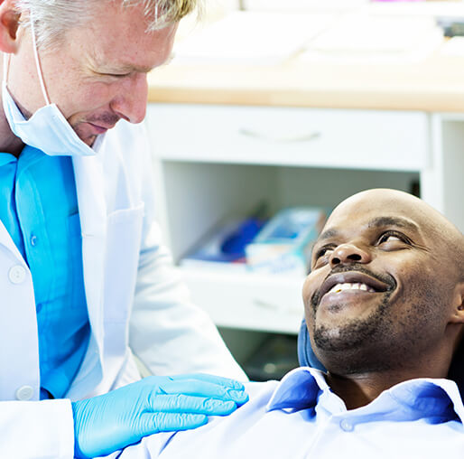 dentist comforting a patient