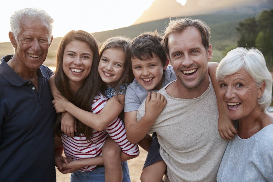 dentist in East Contra Costa County, Multigenerational family with grandparents, parents, and 2 children smiling outside