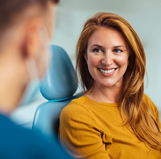 woman talking to her dentist