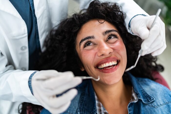 woman getting professional dental cleaning 